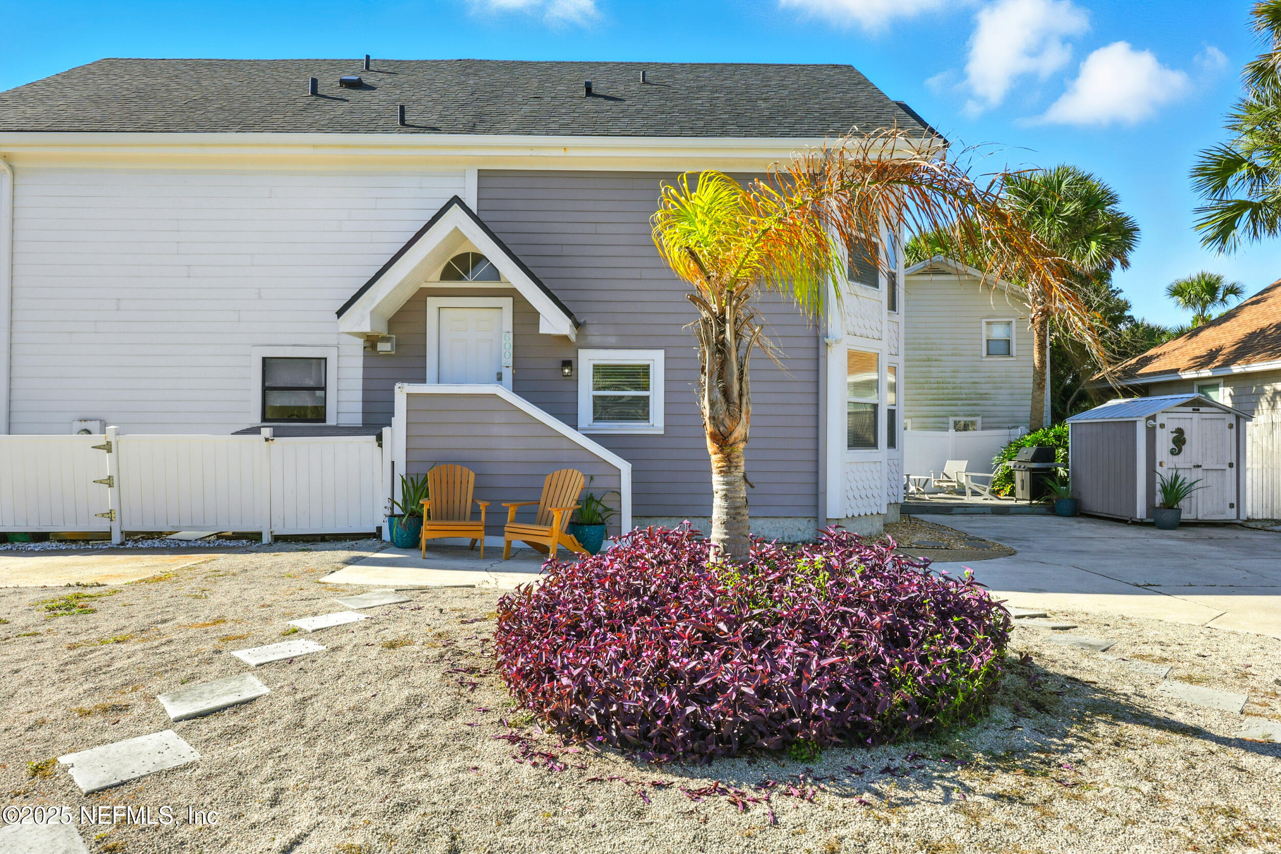 600 First Street Neptune Beach, FL 32266 - Photo 52 of 80 a front view of a house with a yard