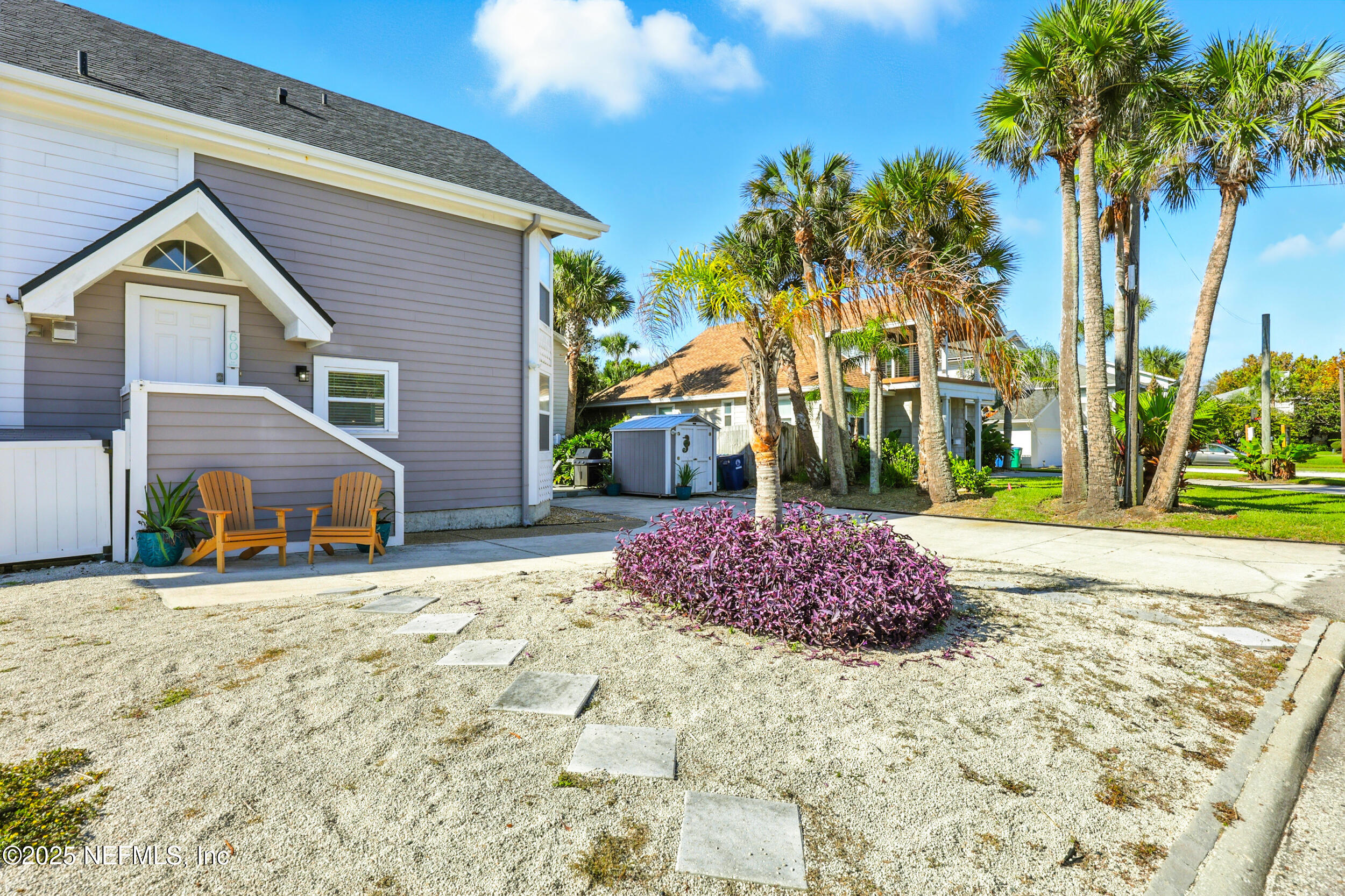 600 First Street Neptune Beach, FL 32266 - Photo 53 of 80 a front view of a house with garden