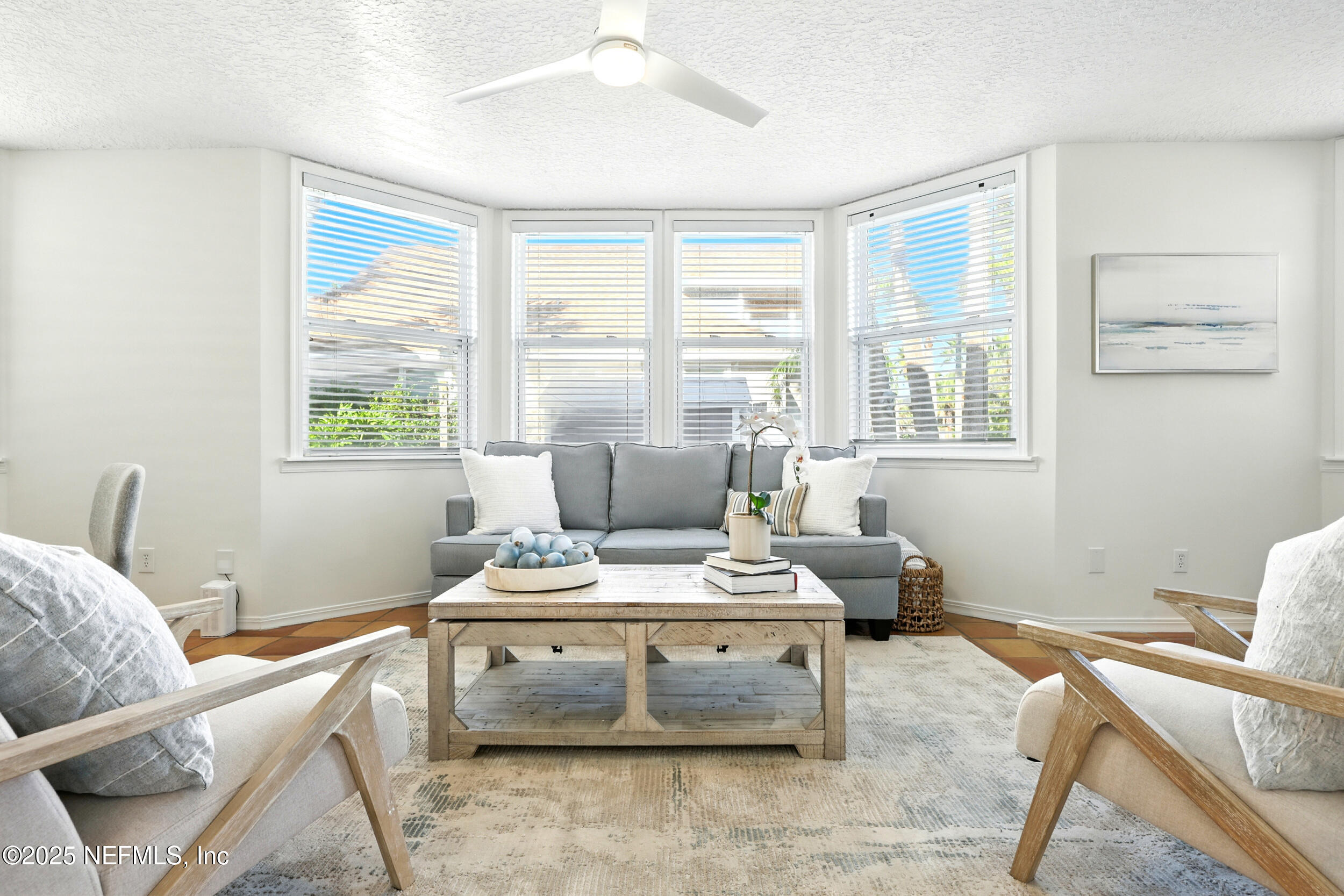 600 First Street Neptune Beach, FL 32266 - Photo 9 of 80 a living room with furniture and windows