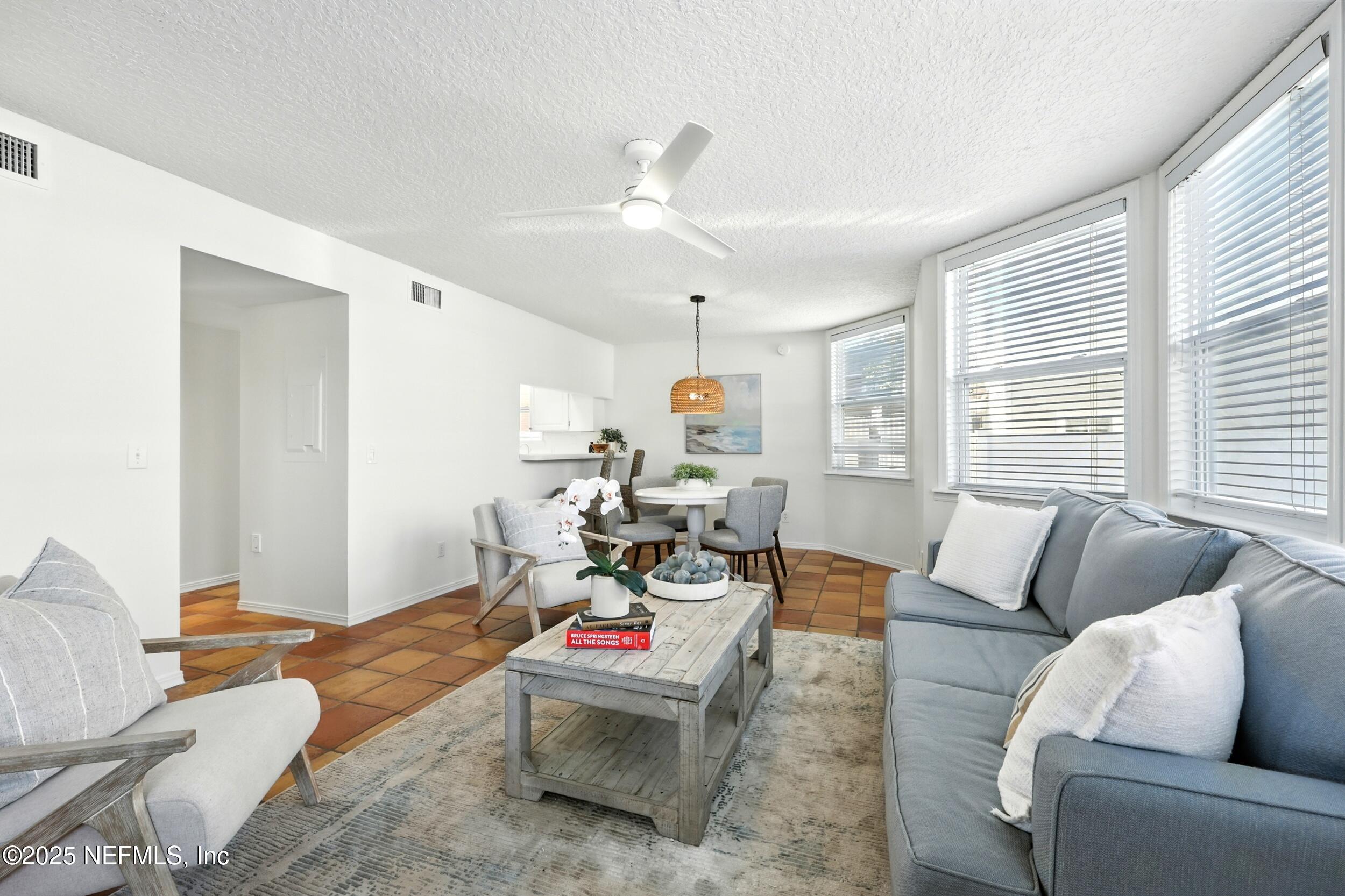 600 First Street Neptune Beach, FL 32266 - Photo 10 of 80 a living room with furniture and a large window