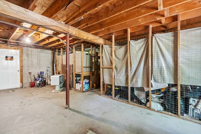 a view of an empty room with wooden walls