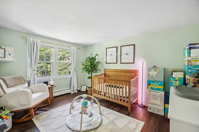 a bedroom with furniture and a wooden floor
