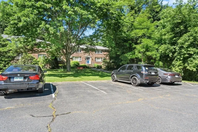 a view of street with parked cars