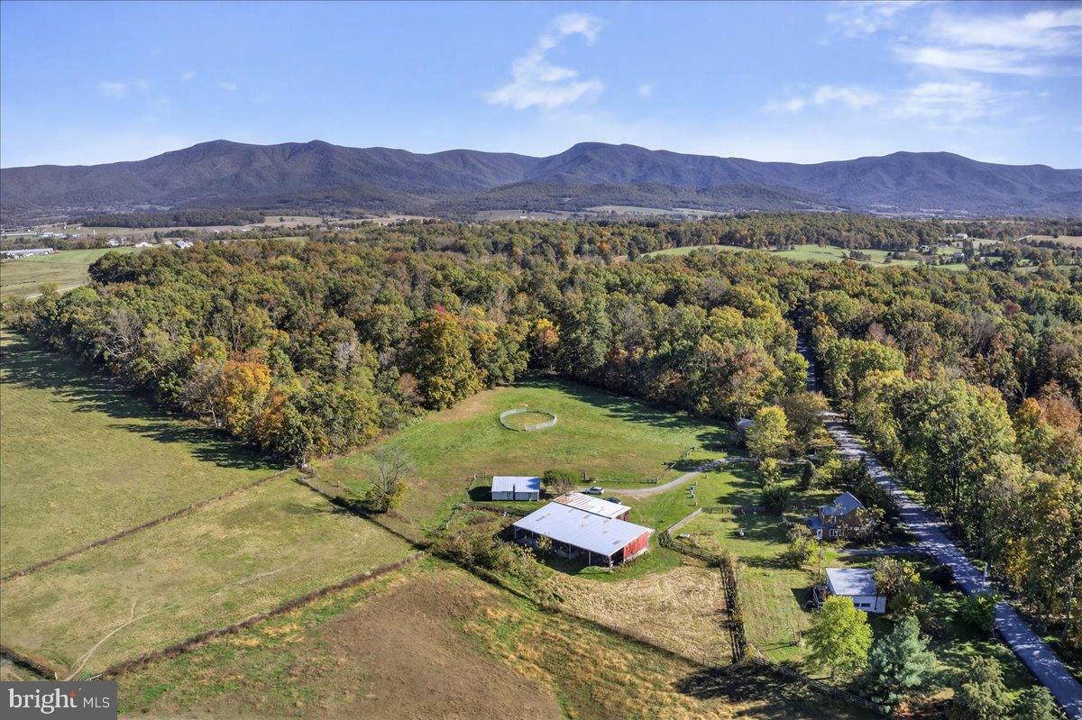 239 Mt Carmel Road Luray, VA 22835 - Photo 116 of 116 a view of a lush green hillside and a houses