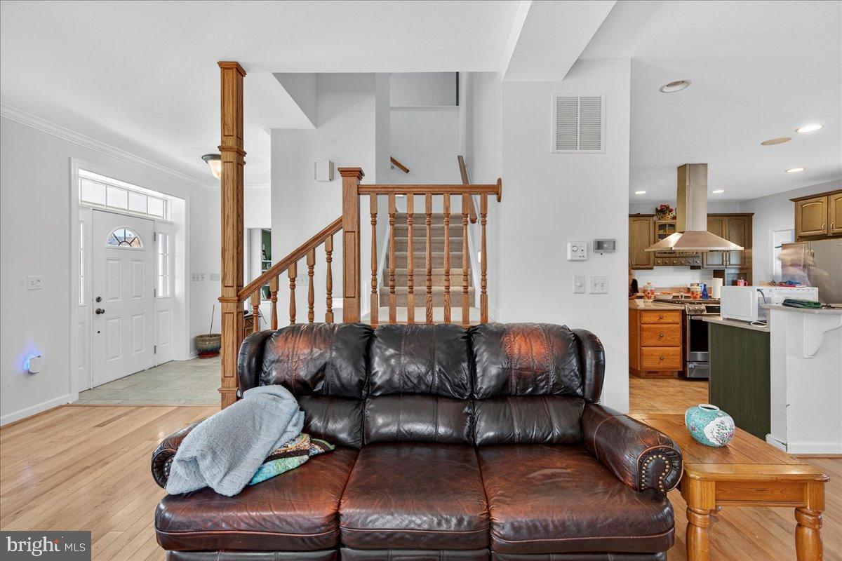 239 Mt Carmel Road Luray, VA 22835 - Photo 19 of 116 a living room with furniture and wooden floor