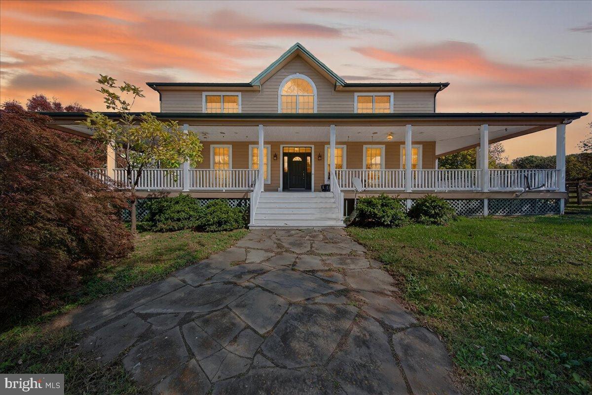 239 Mt Carmel Road Luray, VA 22835 - Photo 2 of 116 Charming home with inviting porch at sunset.
