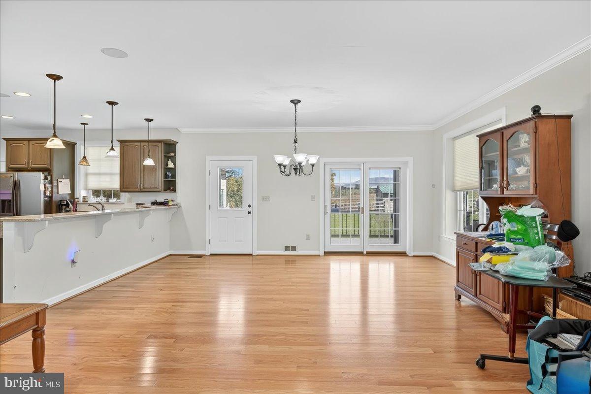 239 Mt Carmel Road Luray, VA 22835 - Photo 22 of 116 a view of an empty room with kitchen and window