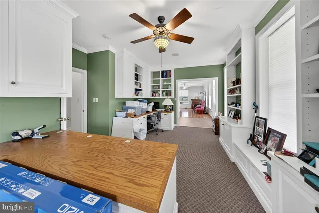 a kitchen that has a lot of cabinets in it