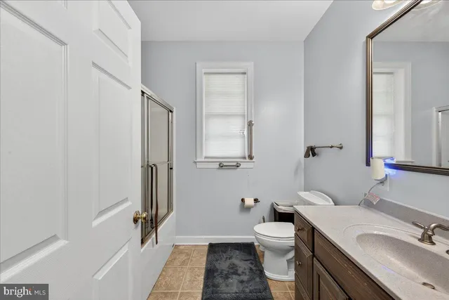 a utility room with sink dryer and washer