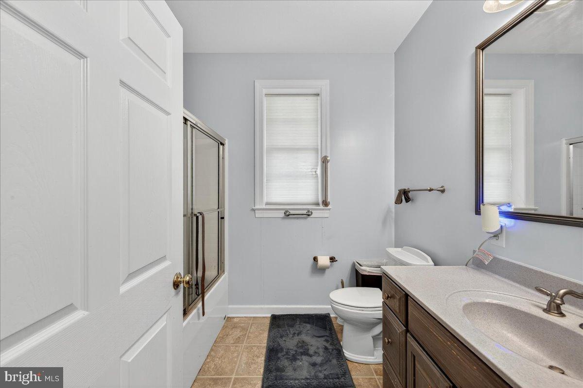 239 Mt Carmel Road Luray, VA 22835 - Photo 28 of 116 a bathroom with a sink a toilet and shower