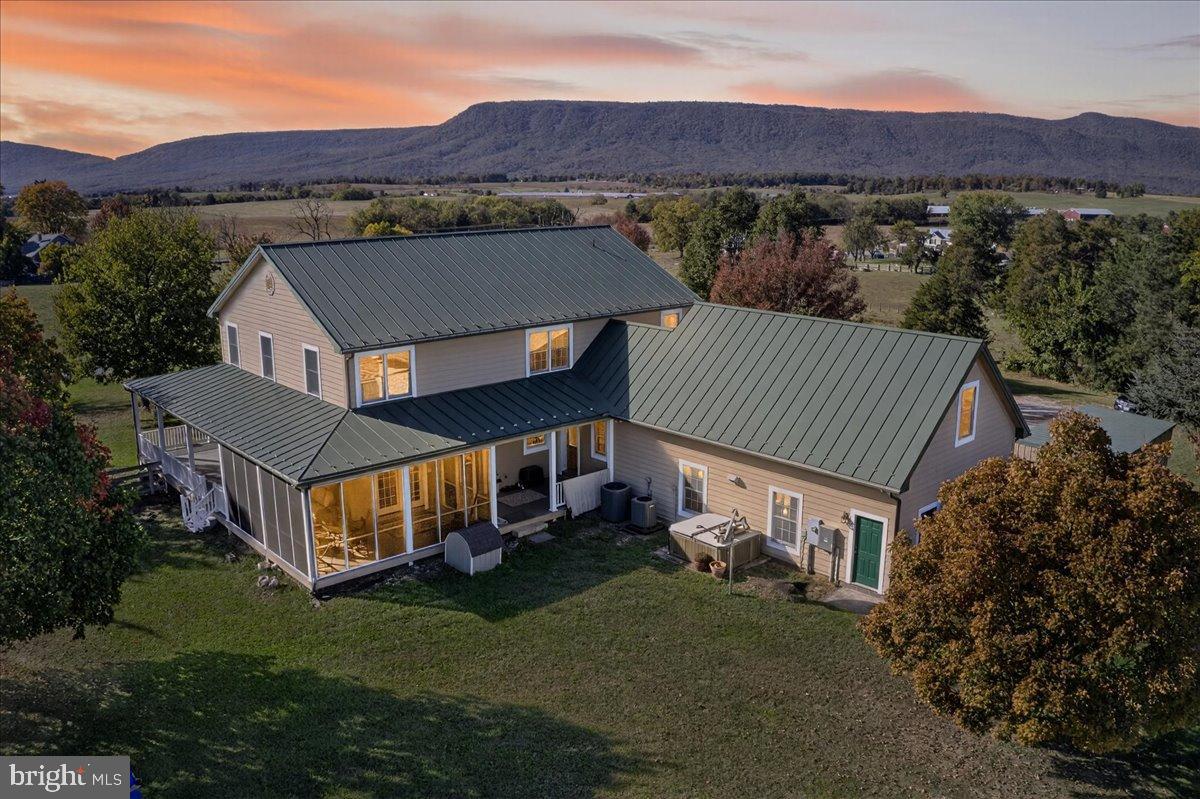 239 Mt Carmel Road Luray, VA 22835 - Photo 3 of 116 Charming home with mountain backdrop at dusk.