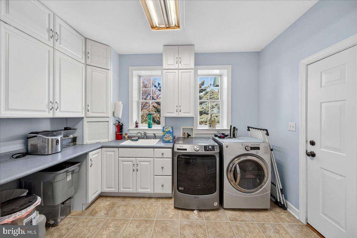 239 Mt Carmel Road Luray, VA 22835 - Photo 59 of 116 a utility room with sink dryer and washer
