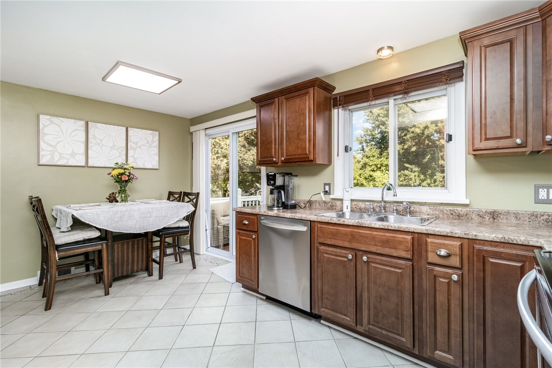 1282 Shoecraft Road Penfield, NY 14580 - Photo 10 of 29 cozy eat-in/sliding glass to deck