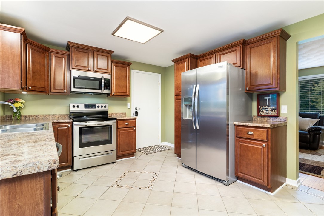 1282 Shoecraft Road Penfield, NY 14580 - Photo 12 of 29 Door to garage, brand new Refrigerator,