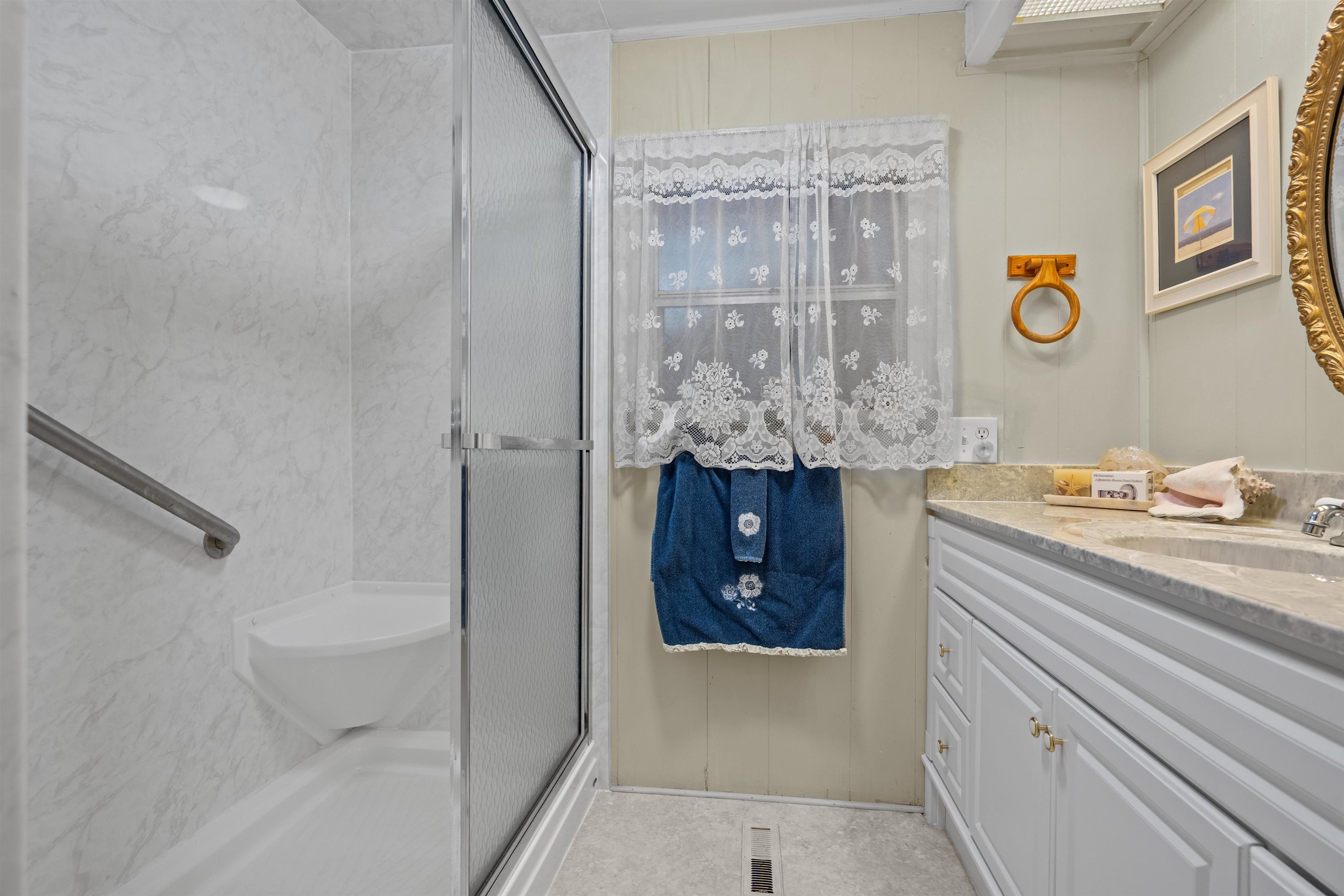 3979 Oak Terrace Road St. Augustine, FL 32086 - Photo 18 of 36 a bathroom with a sink and a mirror