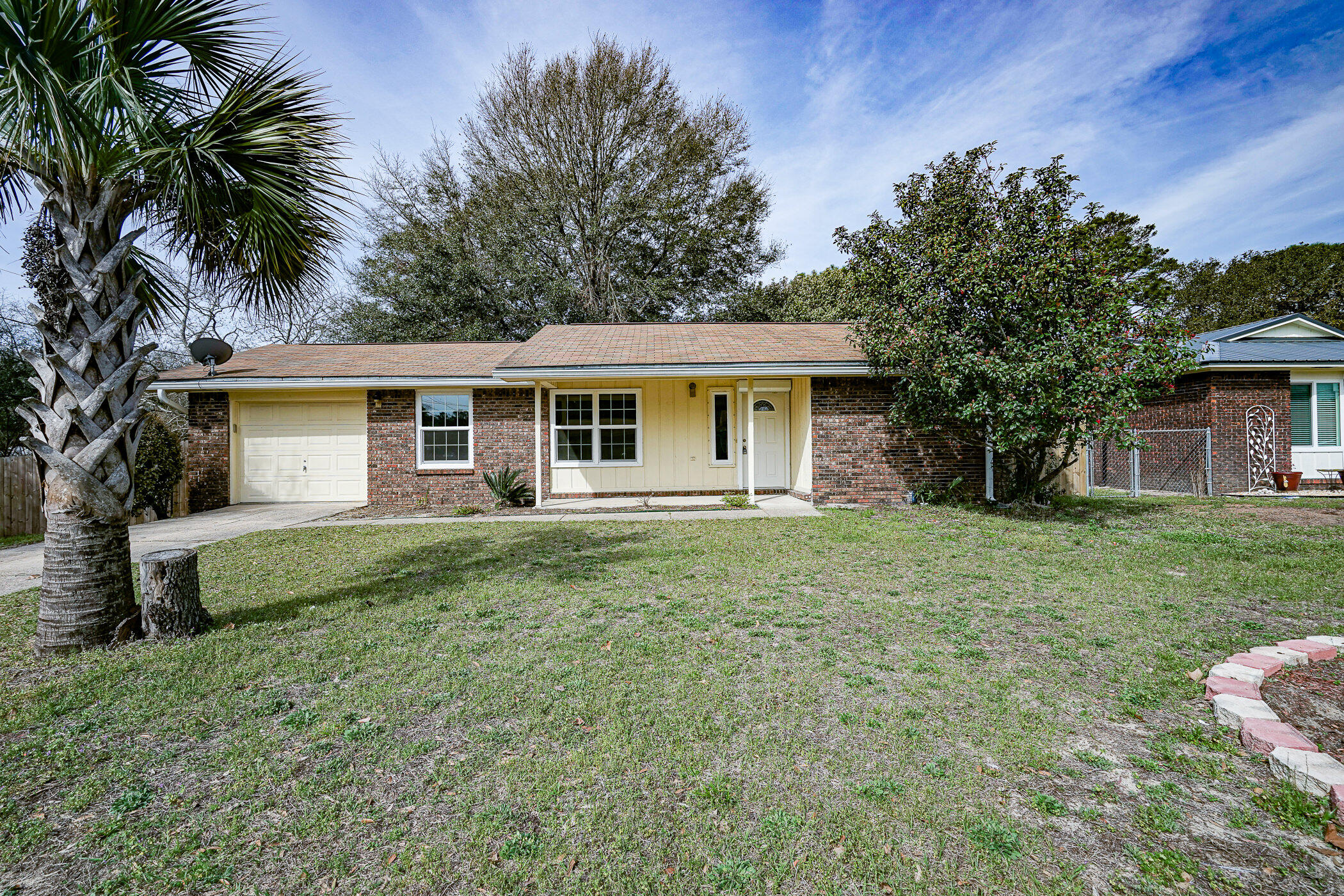 75 7th Street Shalimar, FL 32579 - Photo 2 of 19 a view of a house with a backyard