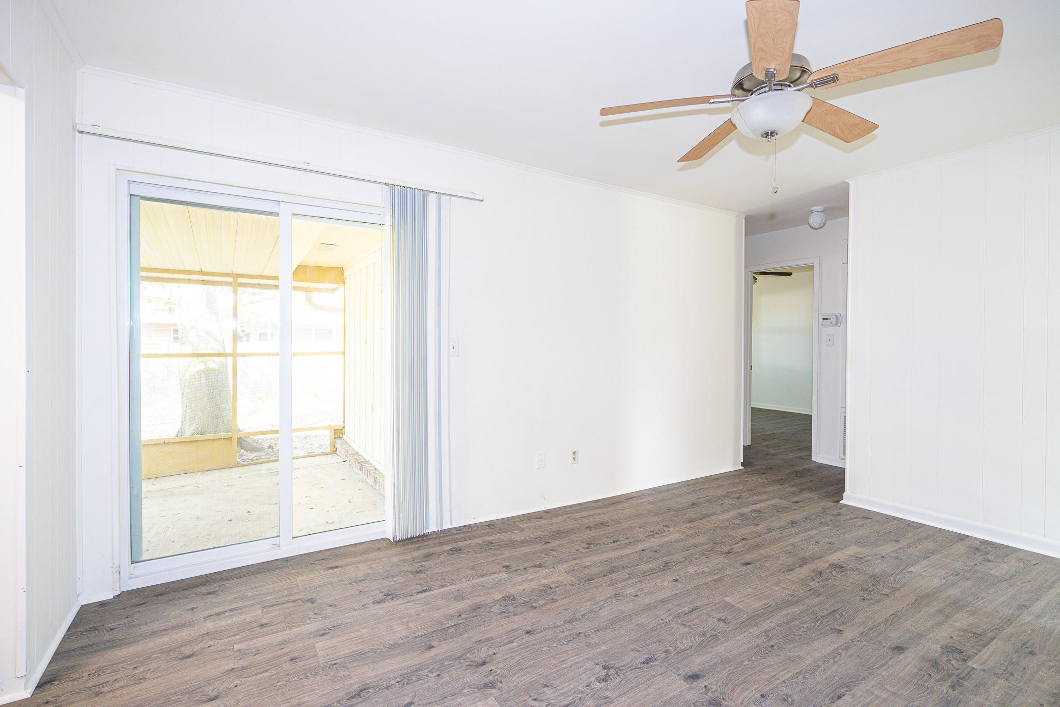 75 7th Street Shalimar, FL 32579 - Photo 11 of 19 wooden floor in an empty room with a window