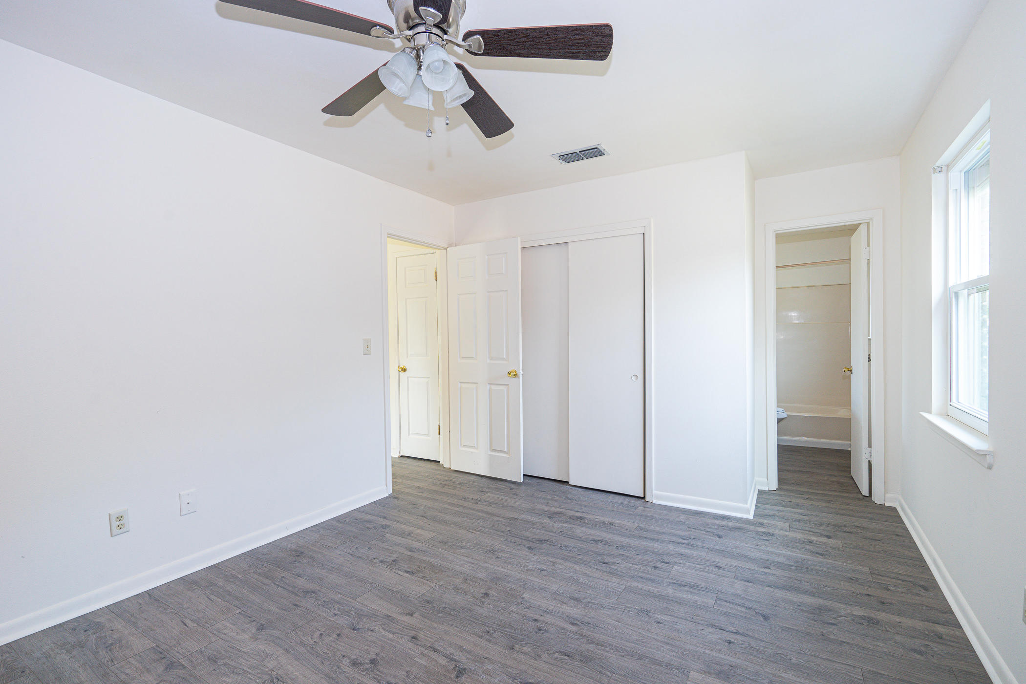 75 7th Street Shalimar, FL 32579 - Photo 15 of 19 wooden floor in an empty room with a window