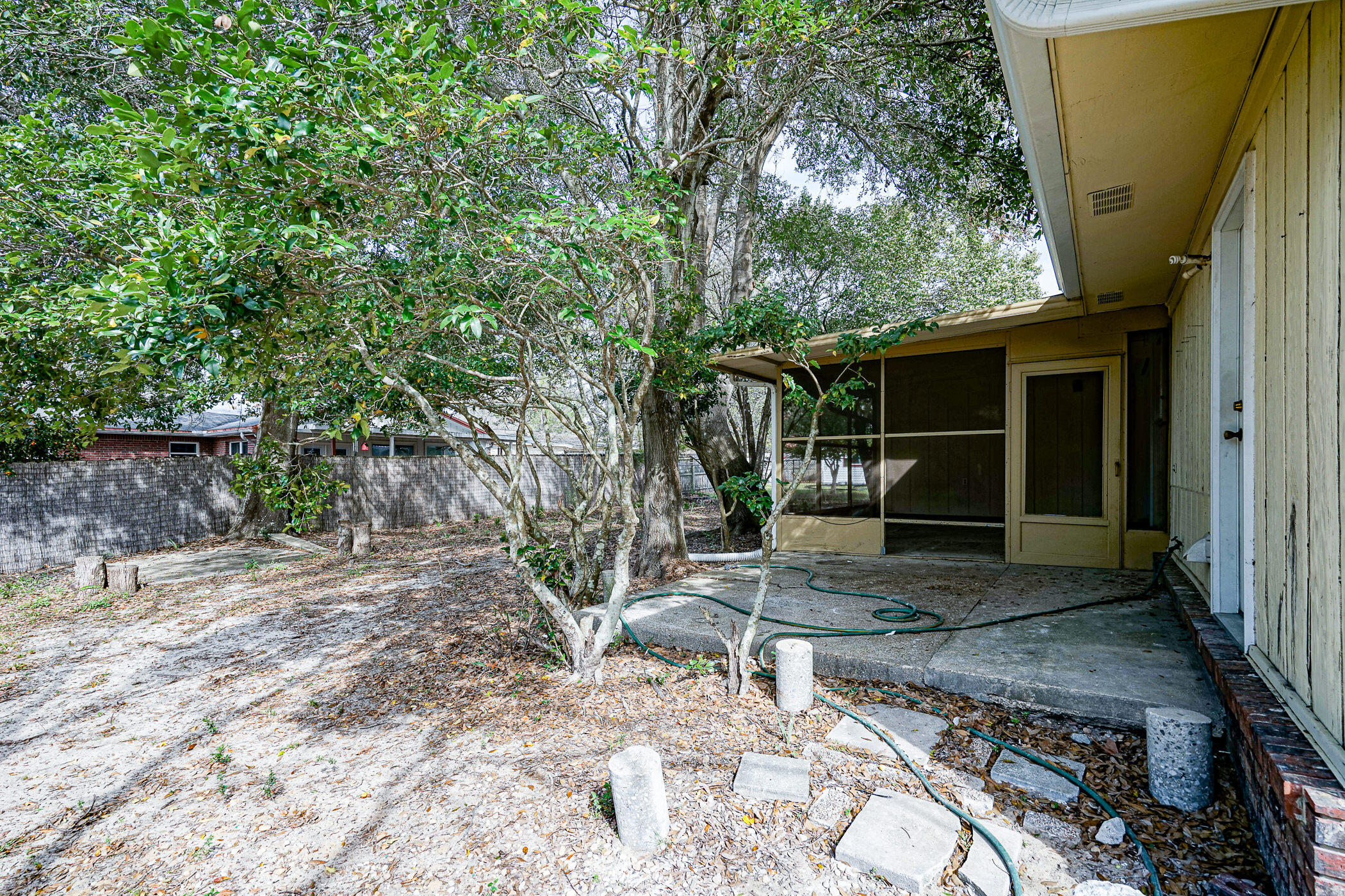 75 7th Street Shalimar, FL 32579 - Photo 19 of 19 a backyard of a house with seating space