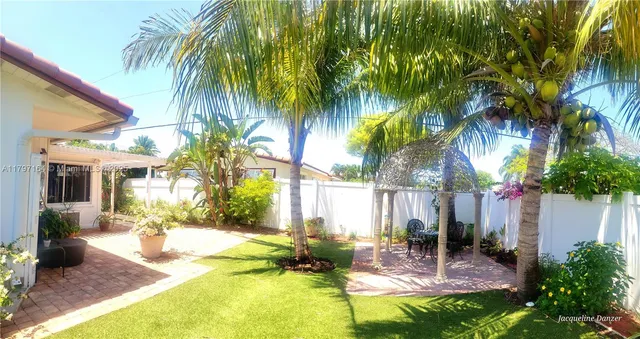 a view of a backyard with a patio