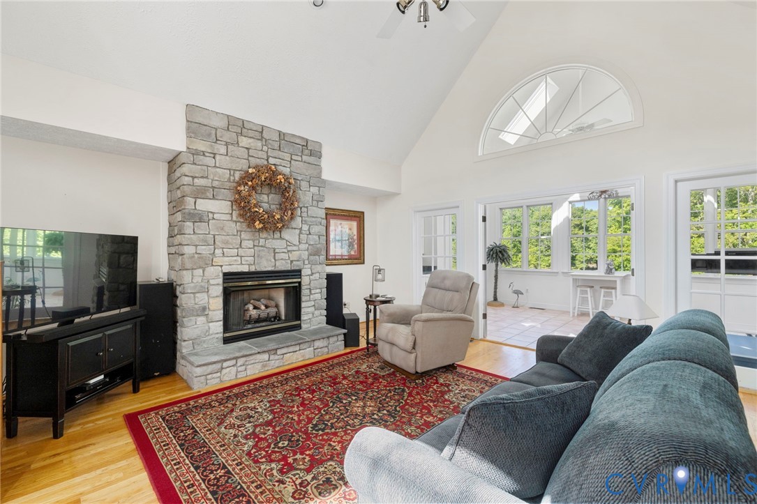 15441 Goshen Road Montpelier, VA 23192 - Photo 12 of 47 a living room with furniture a rug and a fireplace