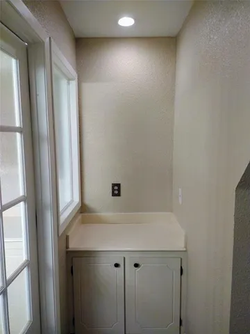 a bathroom with a sink and cabinets