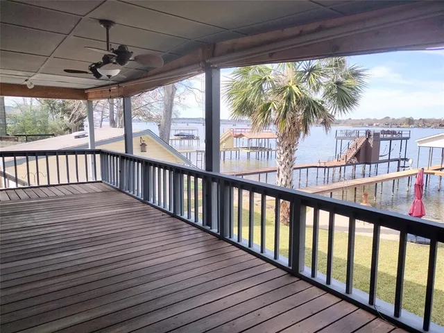 a view of balcony with wooden floor