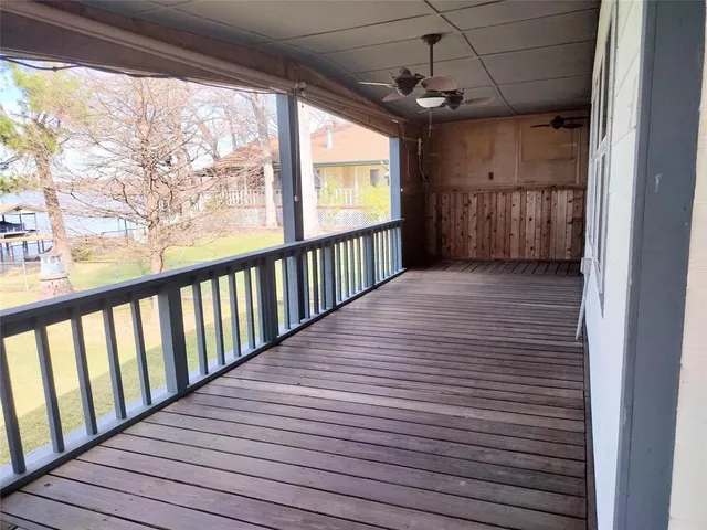 a view of a porch with wooden floor