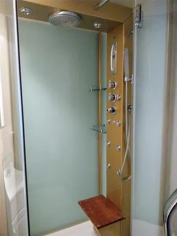 a bathroom with a shower and a sink