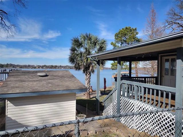 a view of a roof deck with furniture