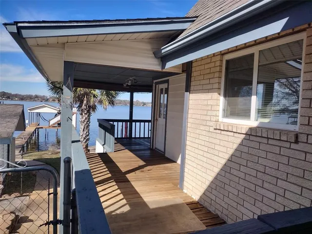 a view of balcony with wooden floor