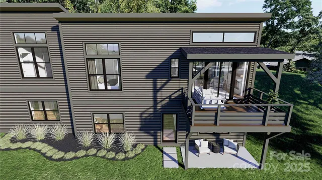 a view of a chair and table in the back yard of the house