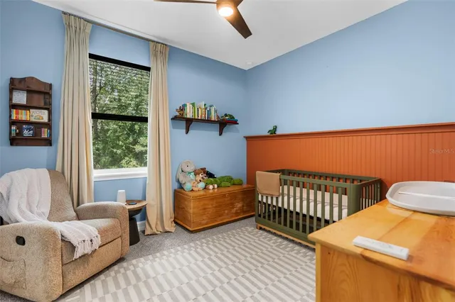 a bedroom with furniture and a window