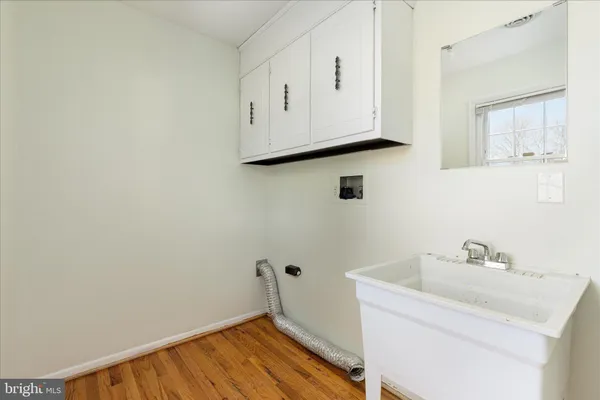 a bathroom with a sink and cabinets