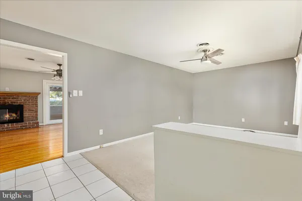 a view of an empty room with a fireplace