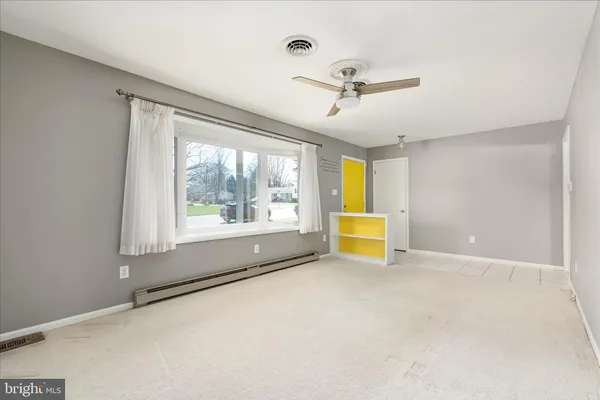 a view of an empty room with a window