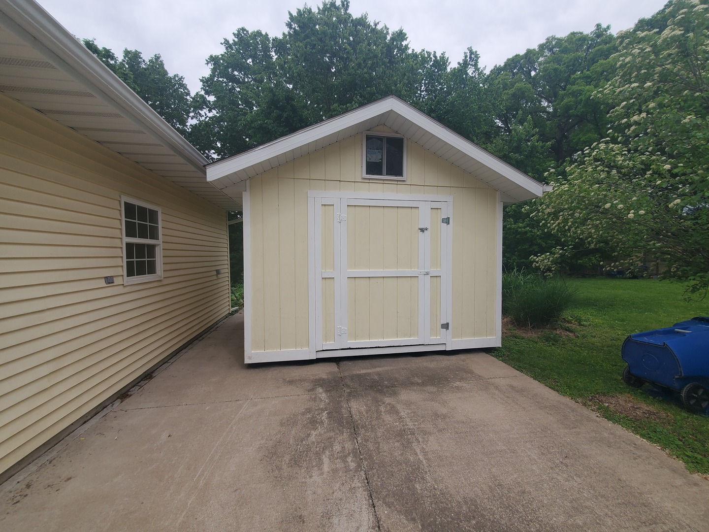 712 3rd Street Moline, IL 61265 - Photo 10 of 29 a view of an house with backyard space and garden