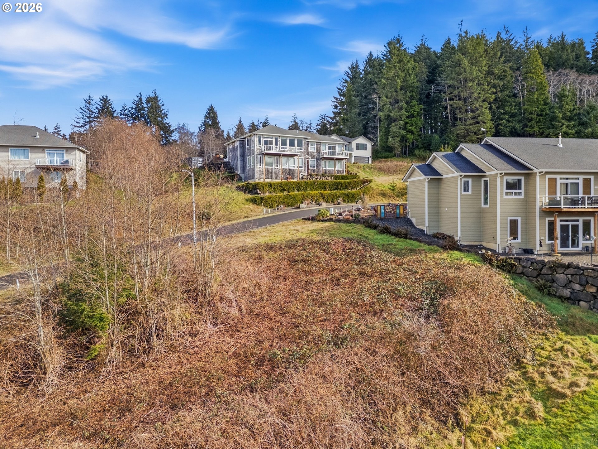 2285 North Fork Road Seaside, OR 97138 - Photo 15 of 22 a view of a house with a big yard and large trees