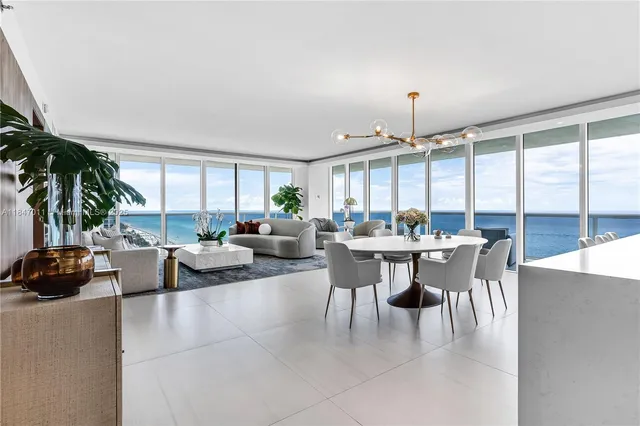 a view of a dining room with furniture window and outside view