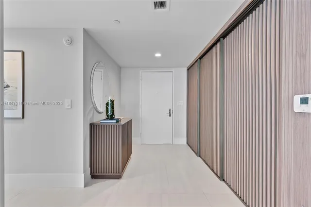 a hallway with a stove top oven
