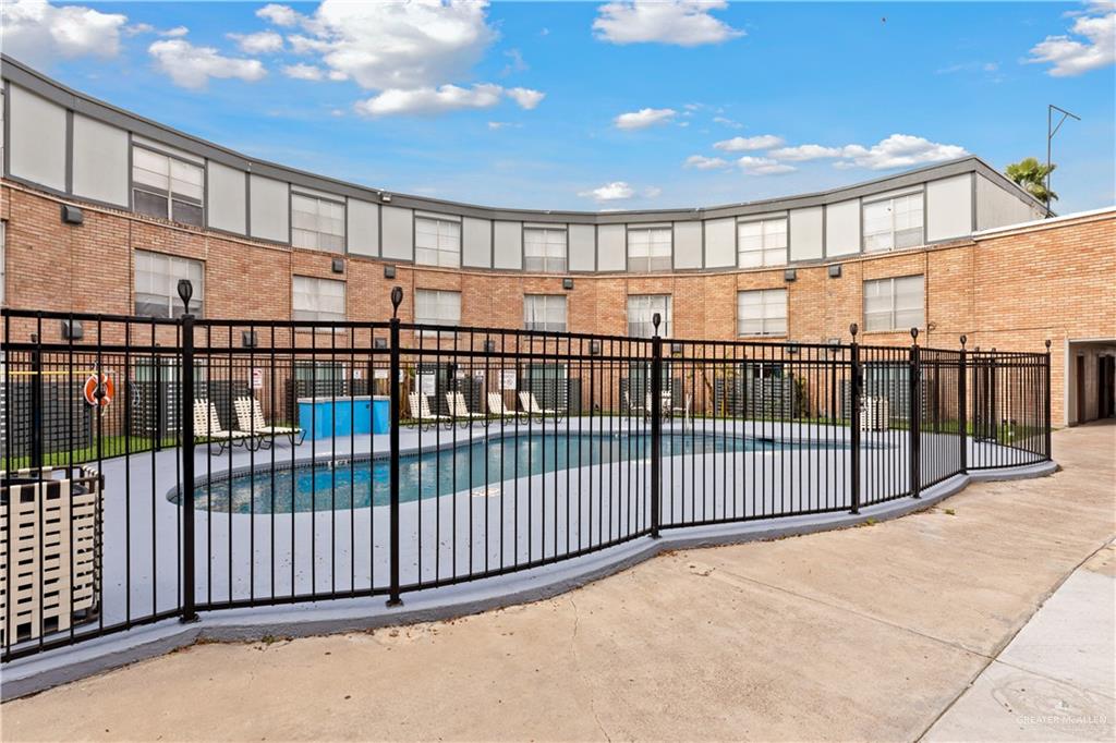 2425 Barnard Road, Unit UJNIT 1A Brownsville, TX 78520 - Photo 14 of 16 Community pool with fence