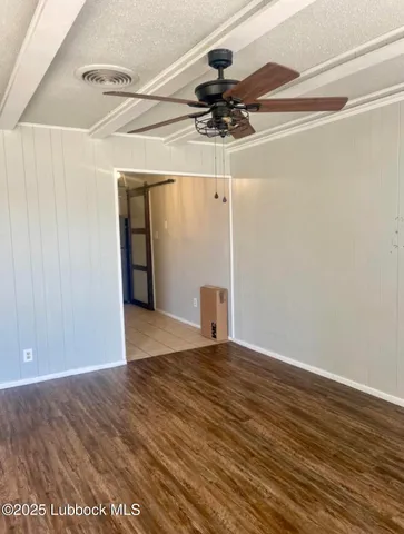 a view of a big room with wooden floor