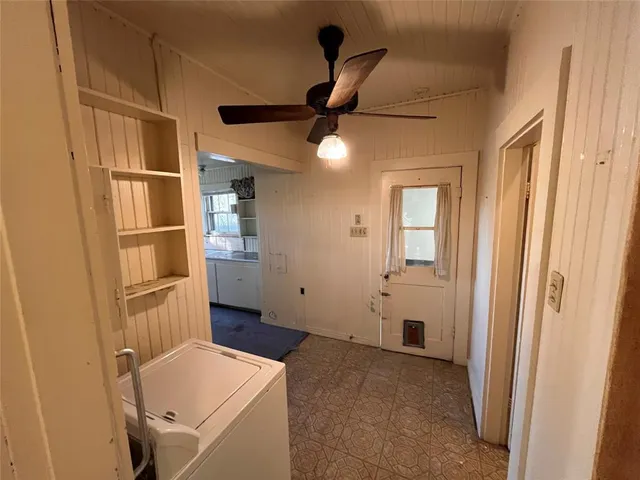 a view of storage and utility room with washer and dryer