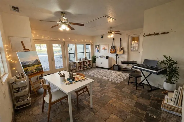 a view of a patio with a table and chairs
