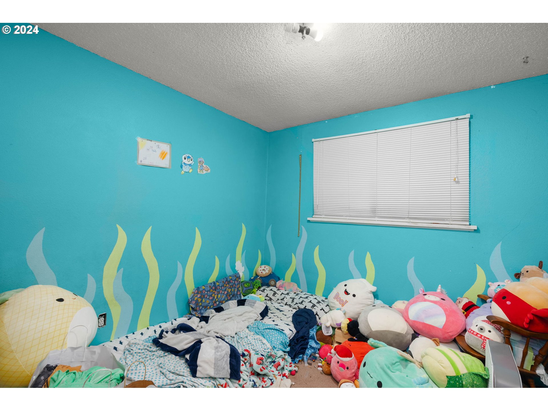 3033 Southeast Condor Avenue Gresham, OR 97080 - Photo 11 of 14 a bathroom with a sink mirror and toilet