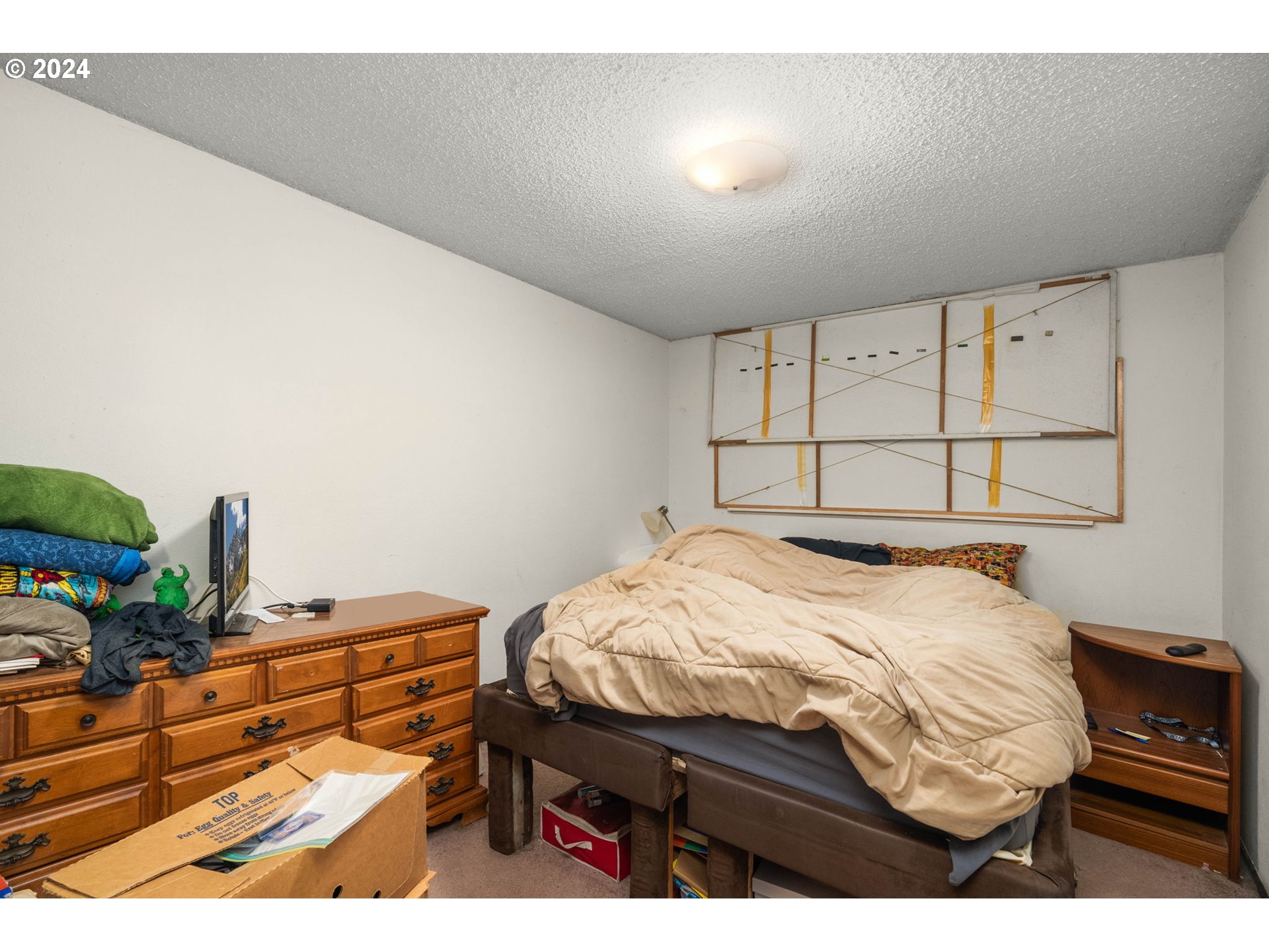 3033 Southeast Condor Avenue Gresham, OR 97080 - Photo 9 of 14 a bedroom with a bed and a tv