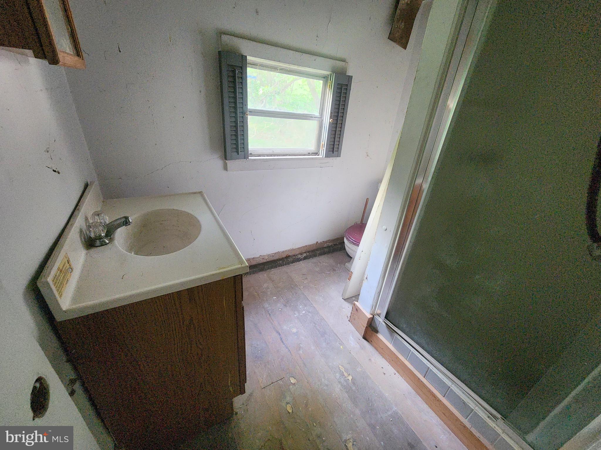 26506 Clarksburg Road Clarksburg, MD 20871 - Photo 27 of 39 a bathroom with a sink and a mirror