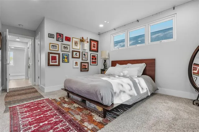 a bedroom with bed and a window