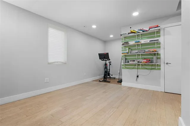 a view of a balcony with wooden floor and fence