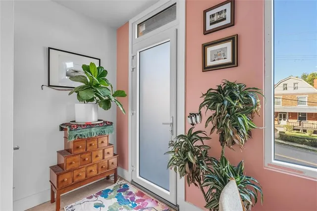a plant in a balcony with a potted plant on a table